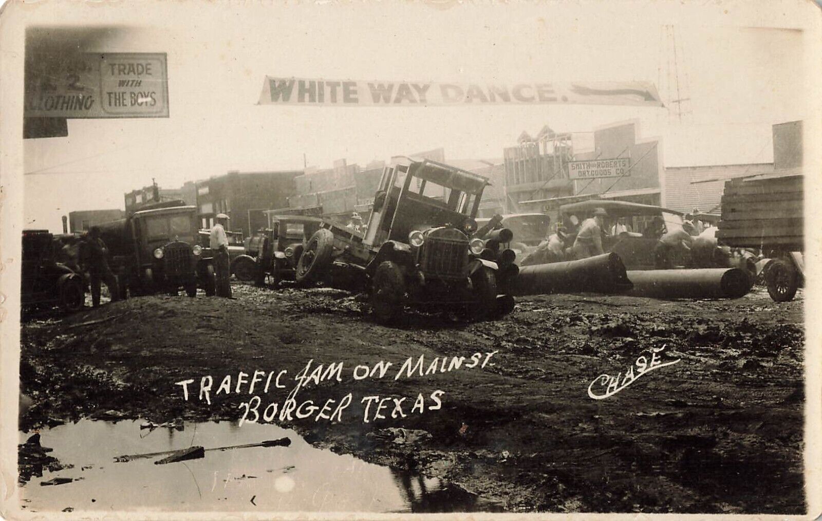 Postcard Borger, Texas: Traffic Jam Main Street Tractors Mud Roads RPPC c1930s