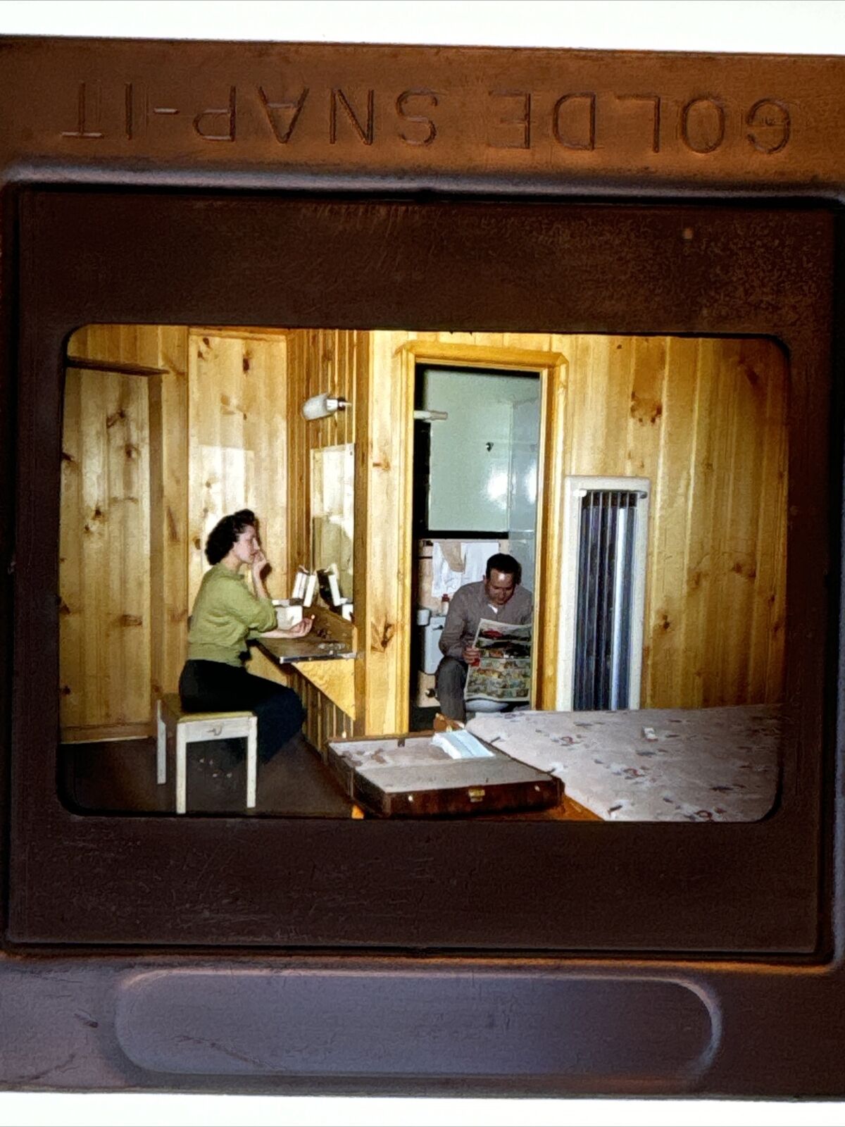 1950s 35mm Slide Man Sitting on Toilet Woman Applying Makeup Motel Room Interior
