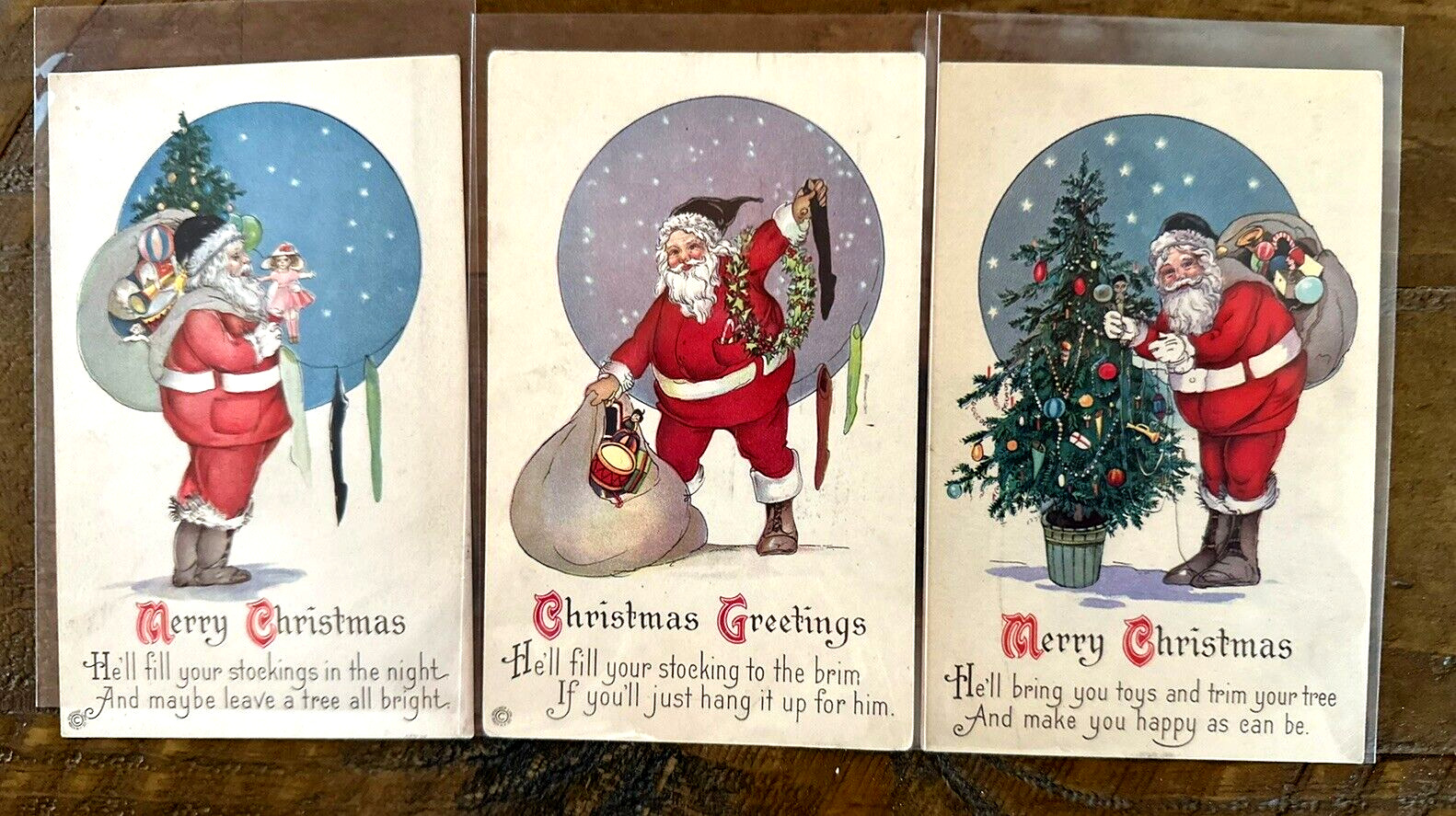Colorful~Lot of 3~SANTA CLAUS w. Tree~Sack~Toys~Antique Christmas Postcards~k522