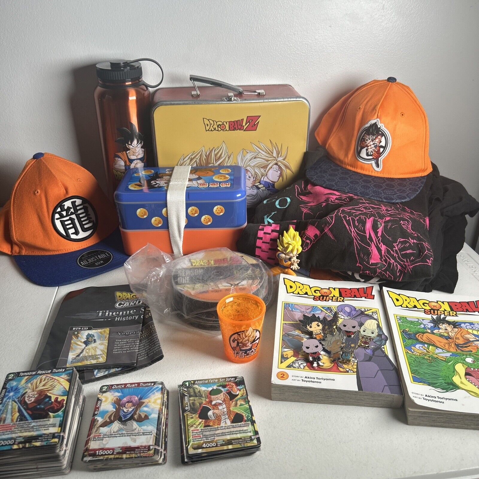 Huge Dragon Ball Z Mix Lot- Shirts, Hats, Tins, Cards, DVDs, Books, Pins& More