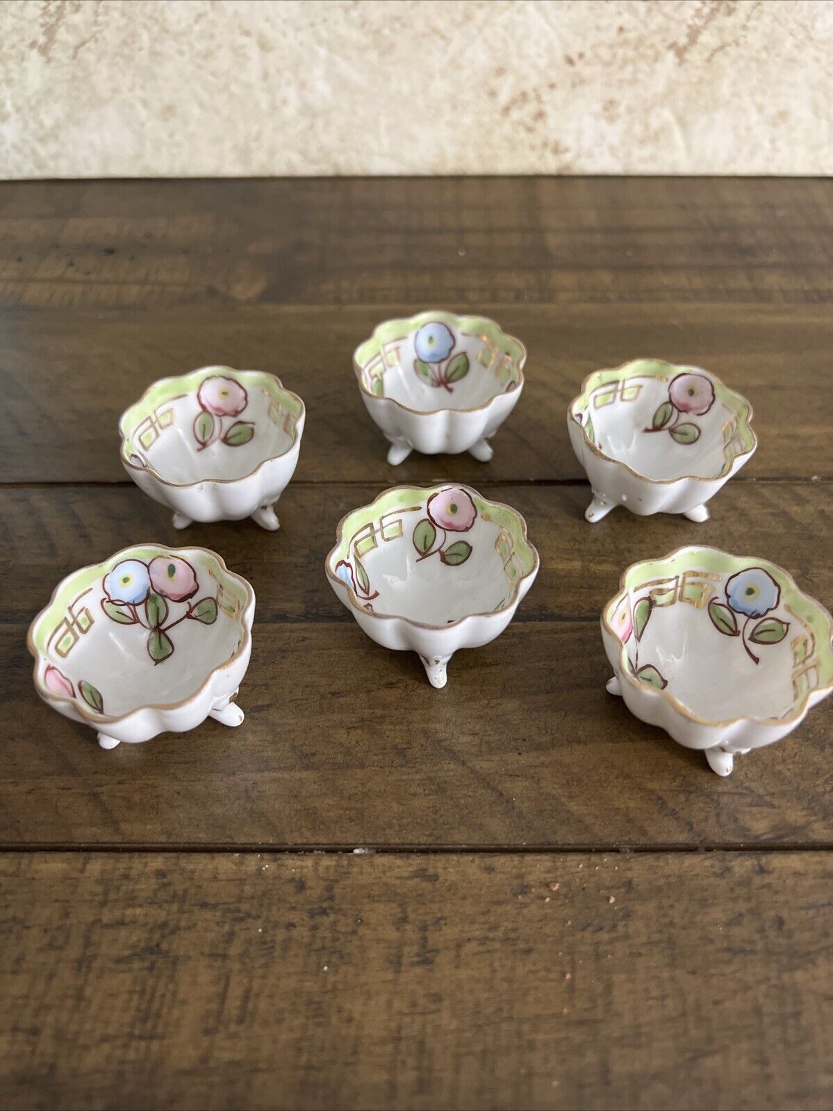 Six vintage hand-painted Nippon porcelain Footed open salt dishes