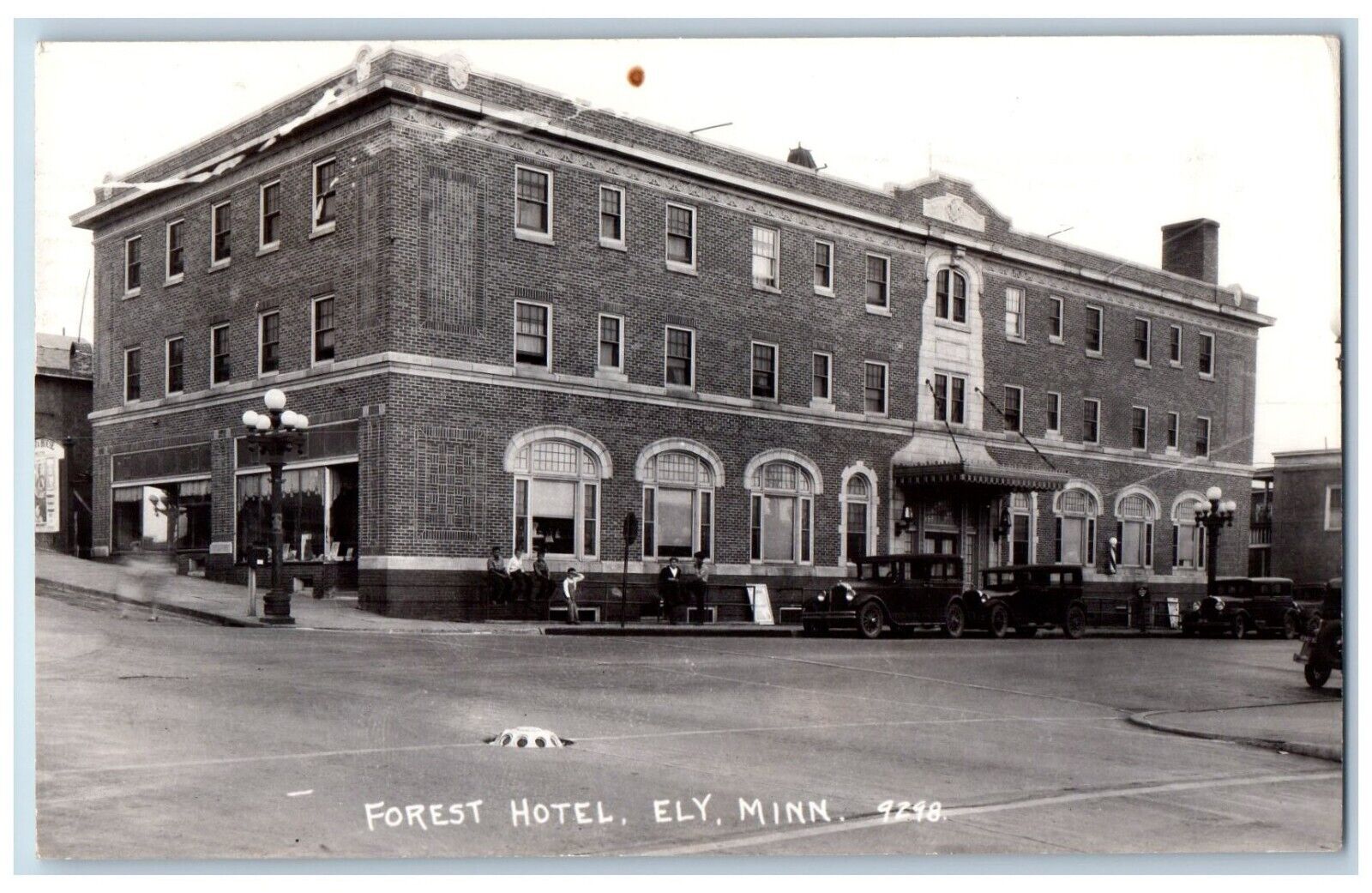 Elly Minnesota MN Postcard RPPC Photo Forest Hotel Building Cars Scene 1940