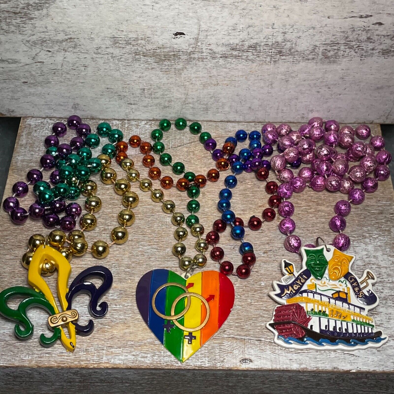 Lot of 3 Mardi Gras Beads: Fleur De Lis, Steamboat NATCHEZ & Rainbow Pride Heart