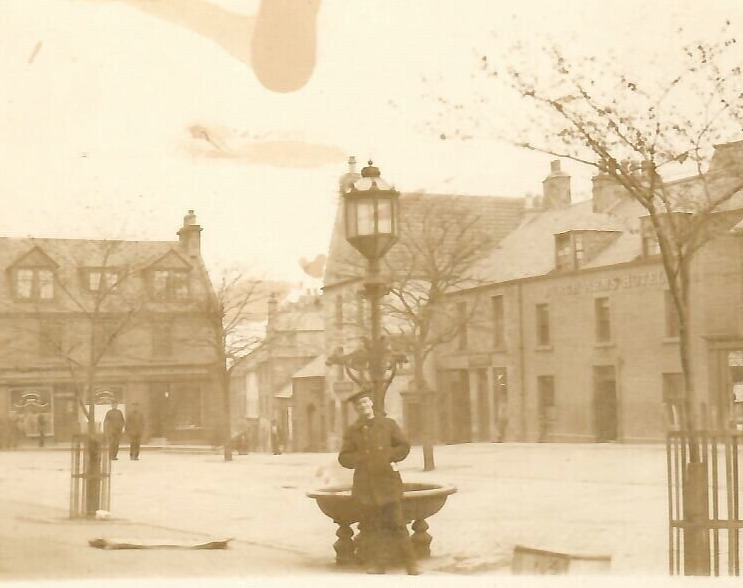 Vintage Real Photo Postcard RPPC Town in Winter Smiling Man Street Lamp Snow