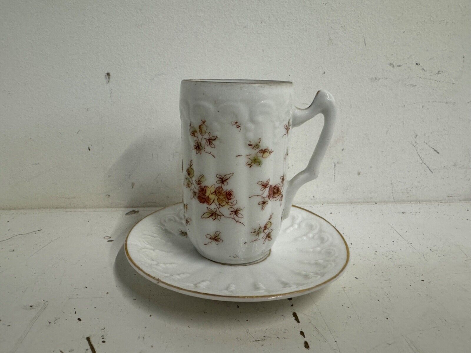 Antique Porcelain Demitasse and Saucer with Multicolored Floral Decorations