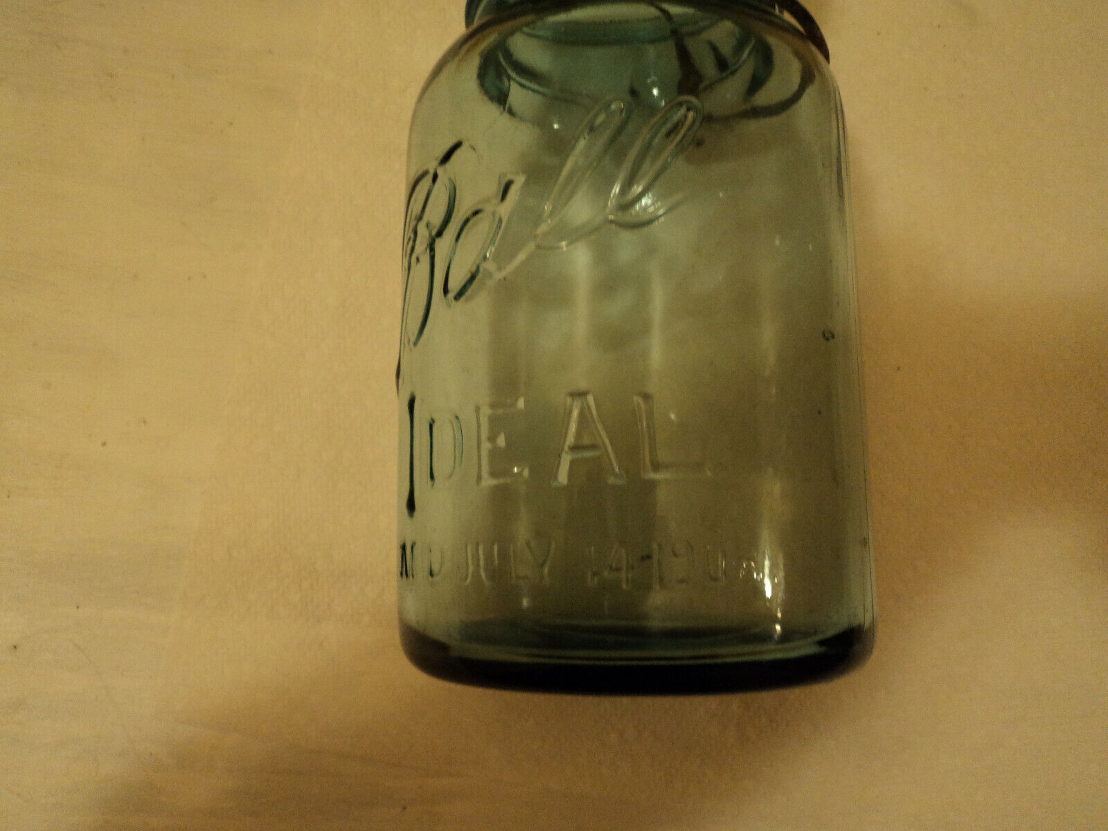 vintage green jar with glass top with wire bail canning jar with dates