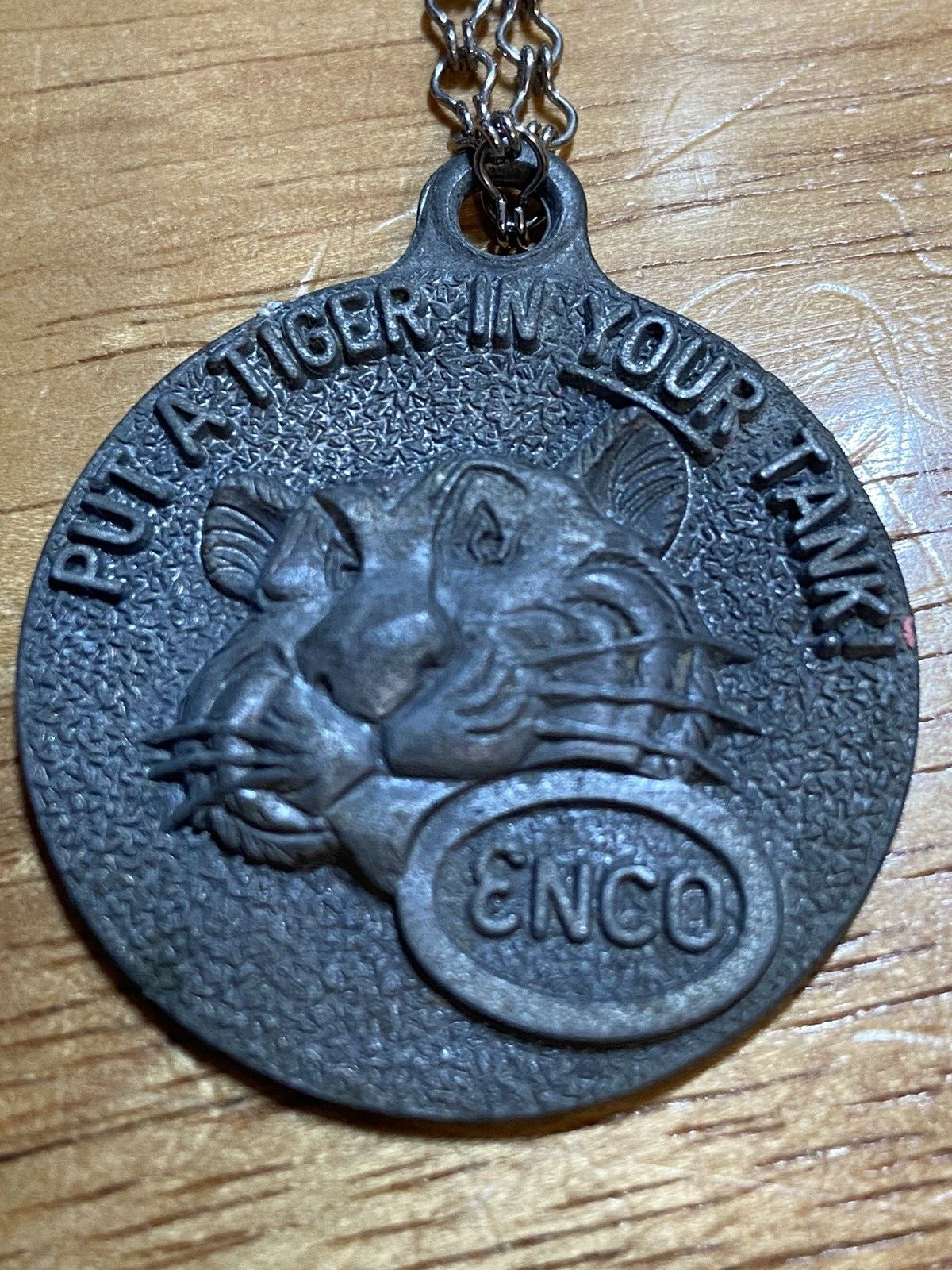 Vintage ENCO Happy Motoring Key Token on a chain