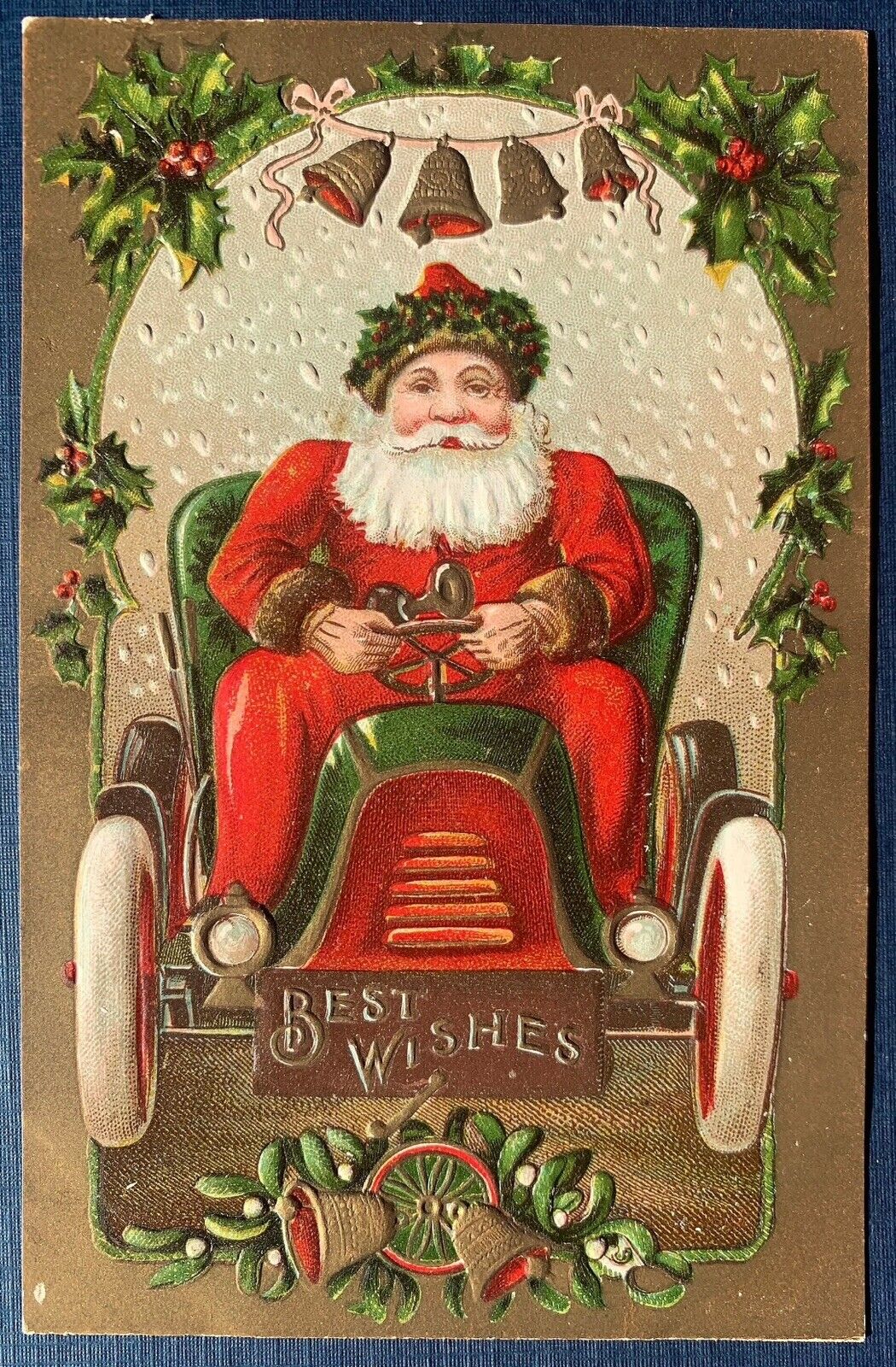 Red Robe Santa Claus in Old Car with Bells & Holly~ Christmas Postcard-k298