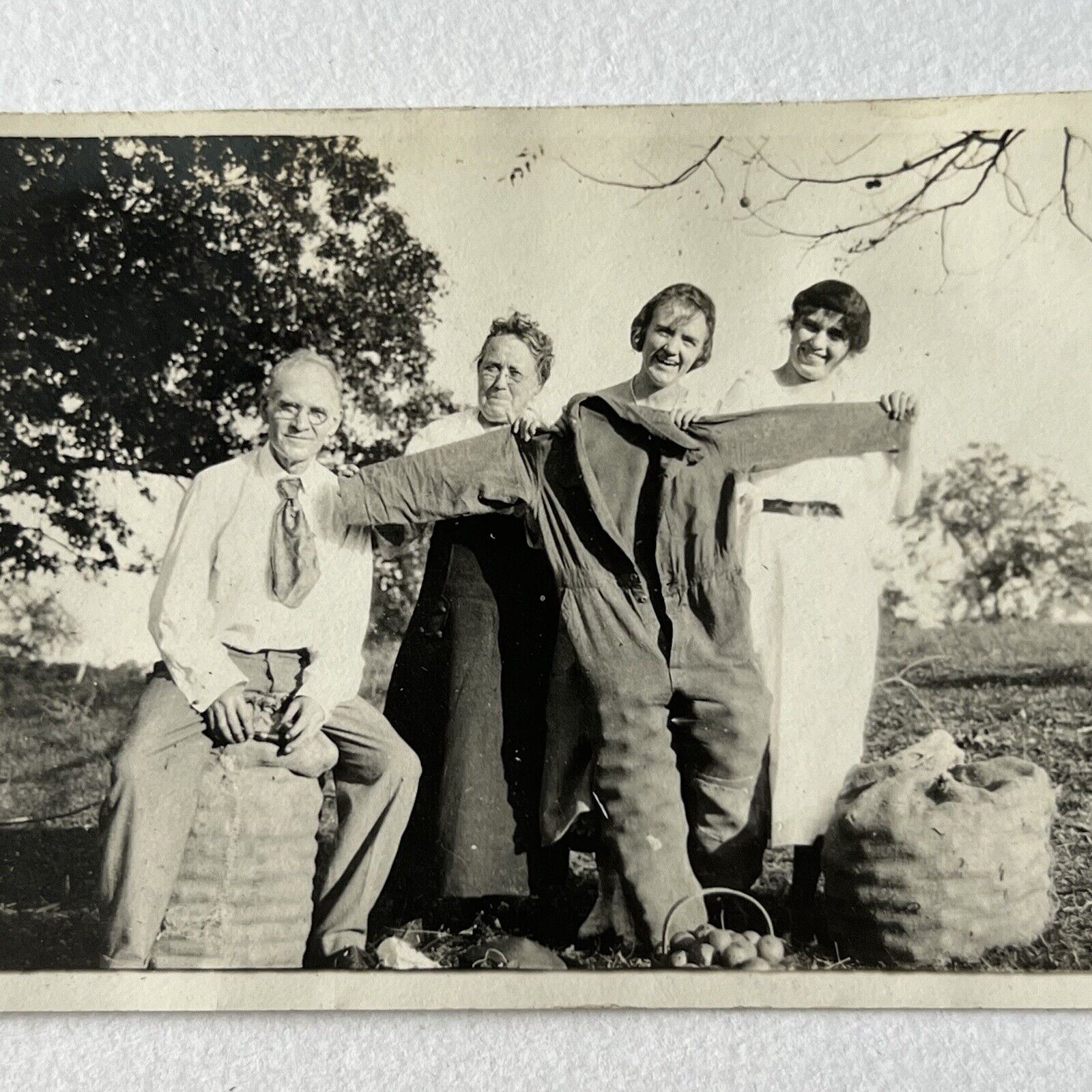 Vintage Snapshot Photograph Man & Women Fun Odd Overalls Full Of Apples Farm
