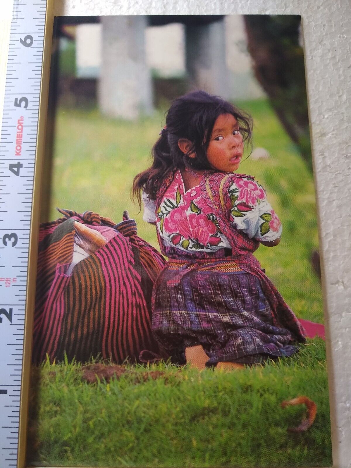 Postcard Guatemalan Girl in Traditional Attire Sitting on the Grass