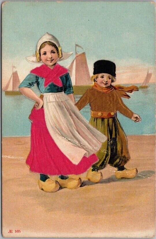 c1910s Dutch Boy & Girl Embossed Greetings Postcard Real Silk Cloth / Unused