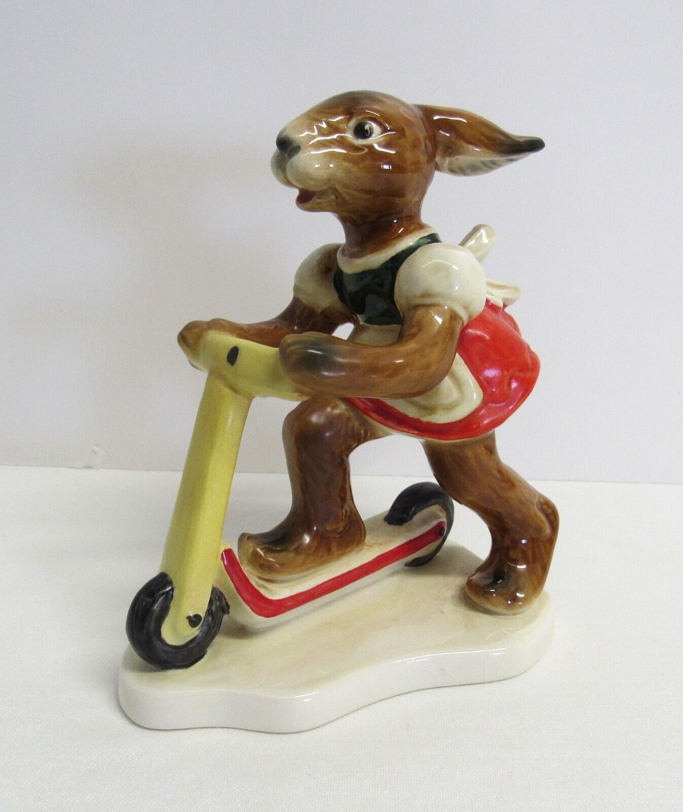 Goebel Bavarian Porcelain Girl Bunny from West Germany - Riding My Scooter - EUC