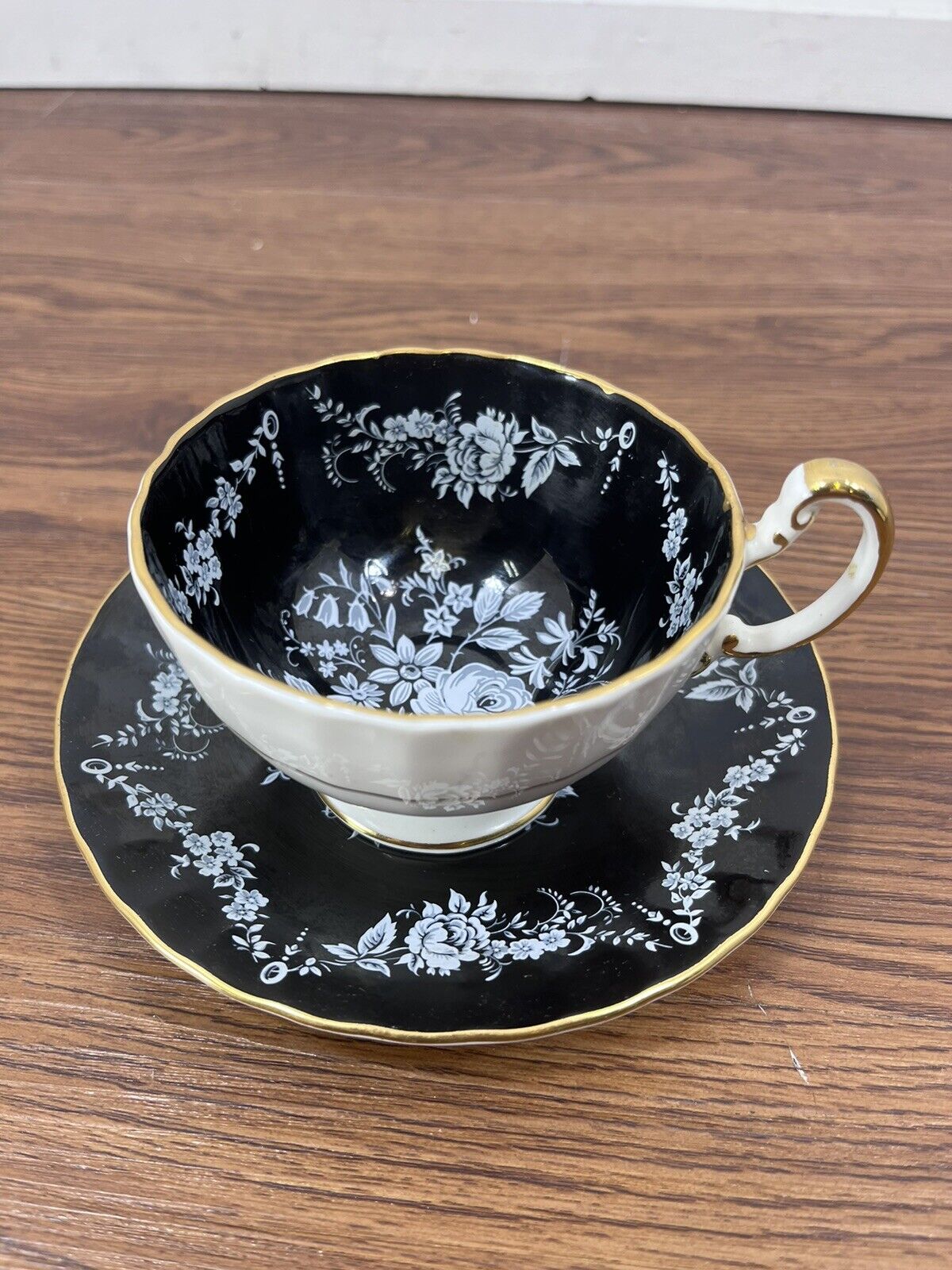 Vintage AYNSLEY Footed Black Teacup Saucer with White Flowers Bone China