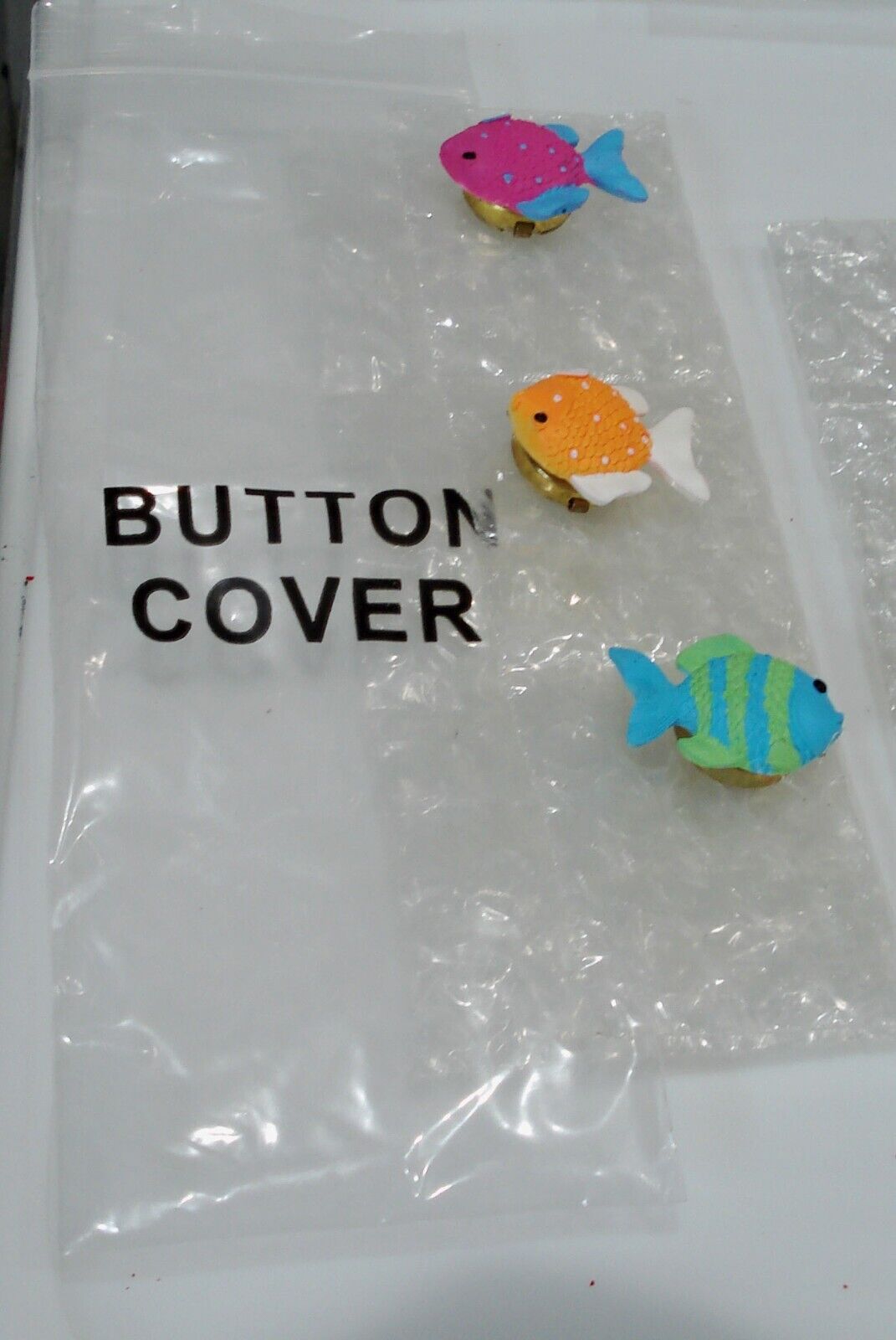 From HSN made for StoryBook Knit Clothing -Set Of 3 Button Covers  - Fish