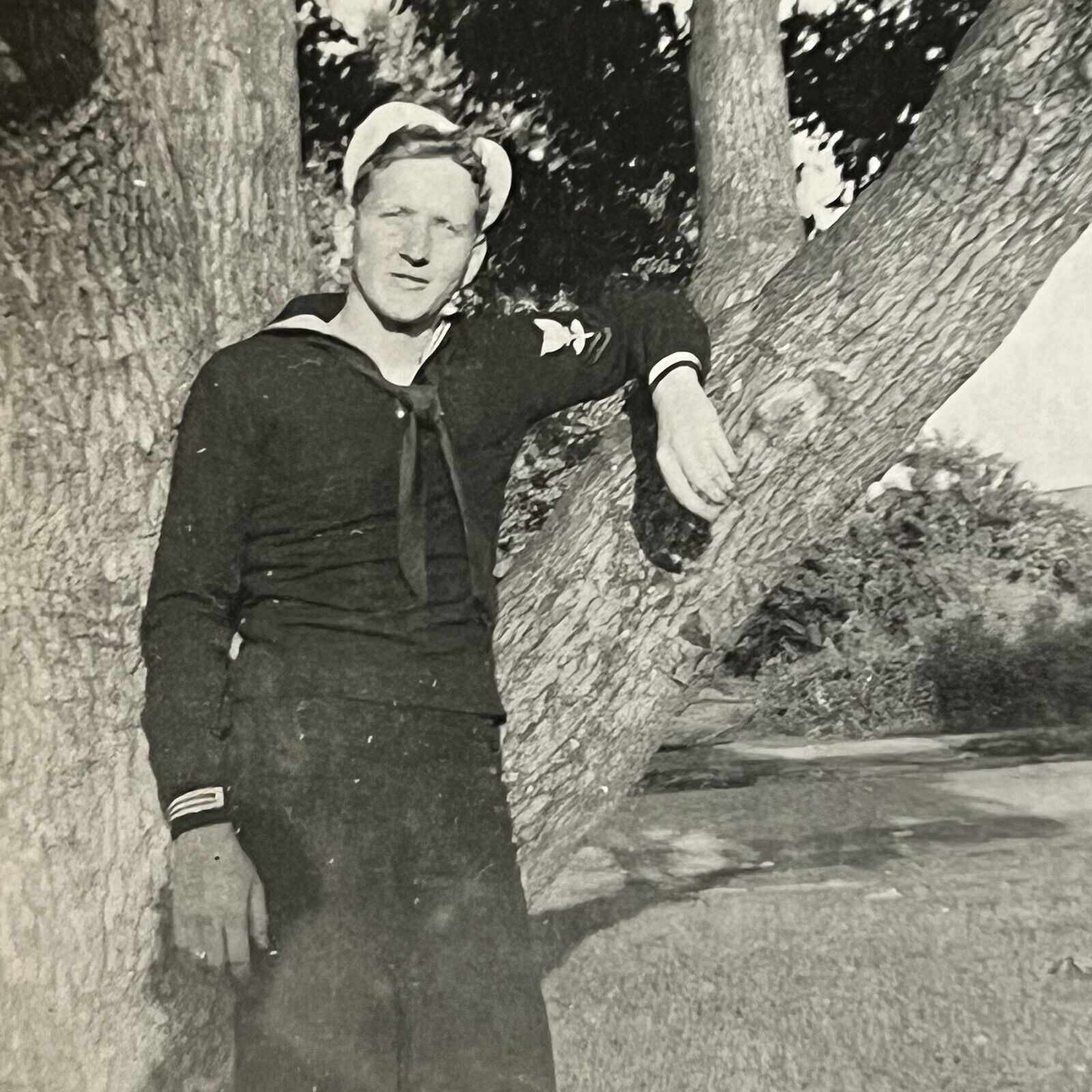 Vintage B&W Snapshot Photograph Handsome Young Navy Man Uniform Leaning On Tree