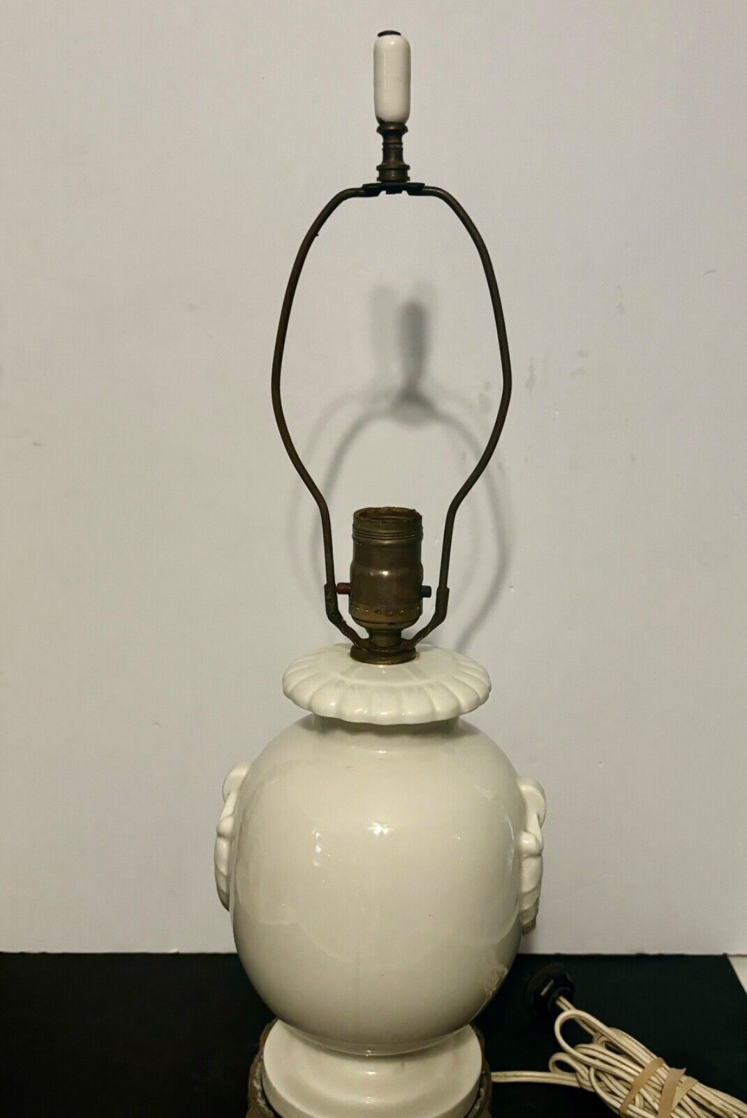 Circa 1940's French porcelain lamp with leaf pattern on body and metal bases.