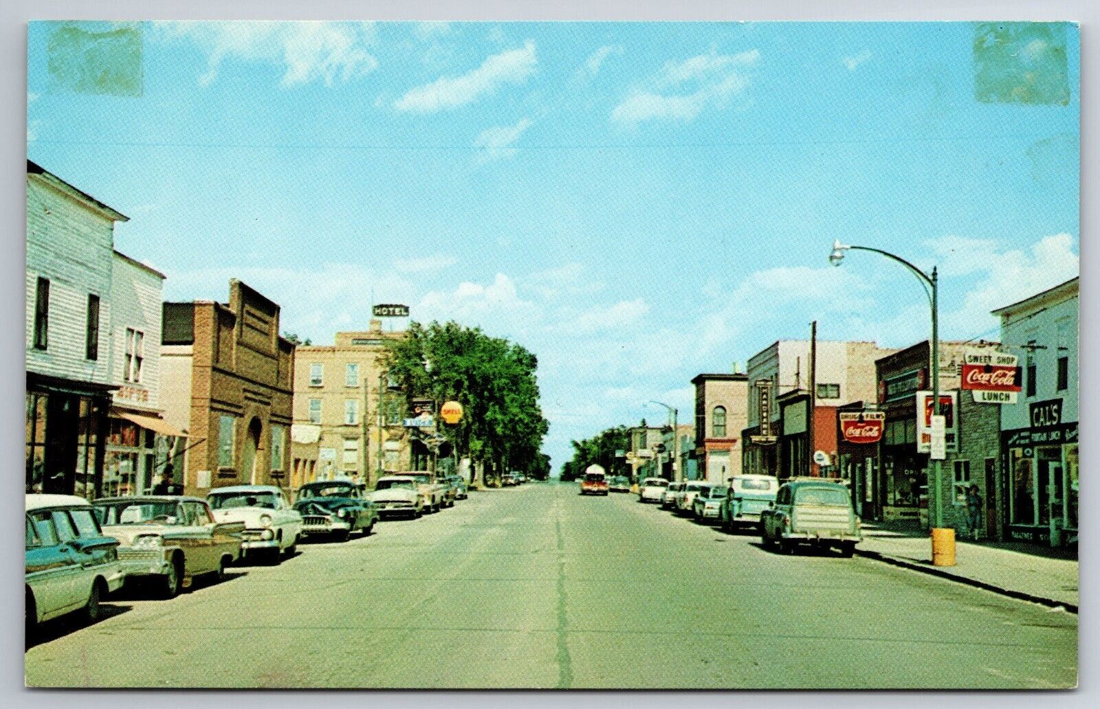 Vintage Postcard MN Cass Lake Main Street 50s Cars Coke Sign Shops Chrome ~13485
