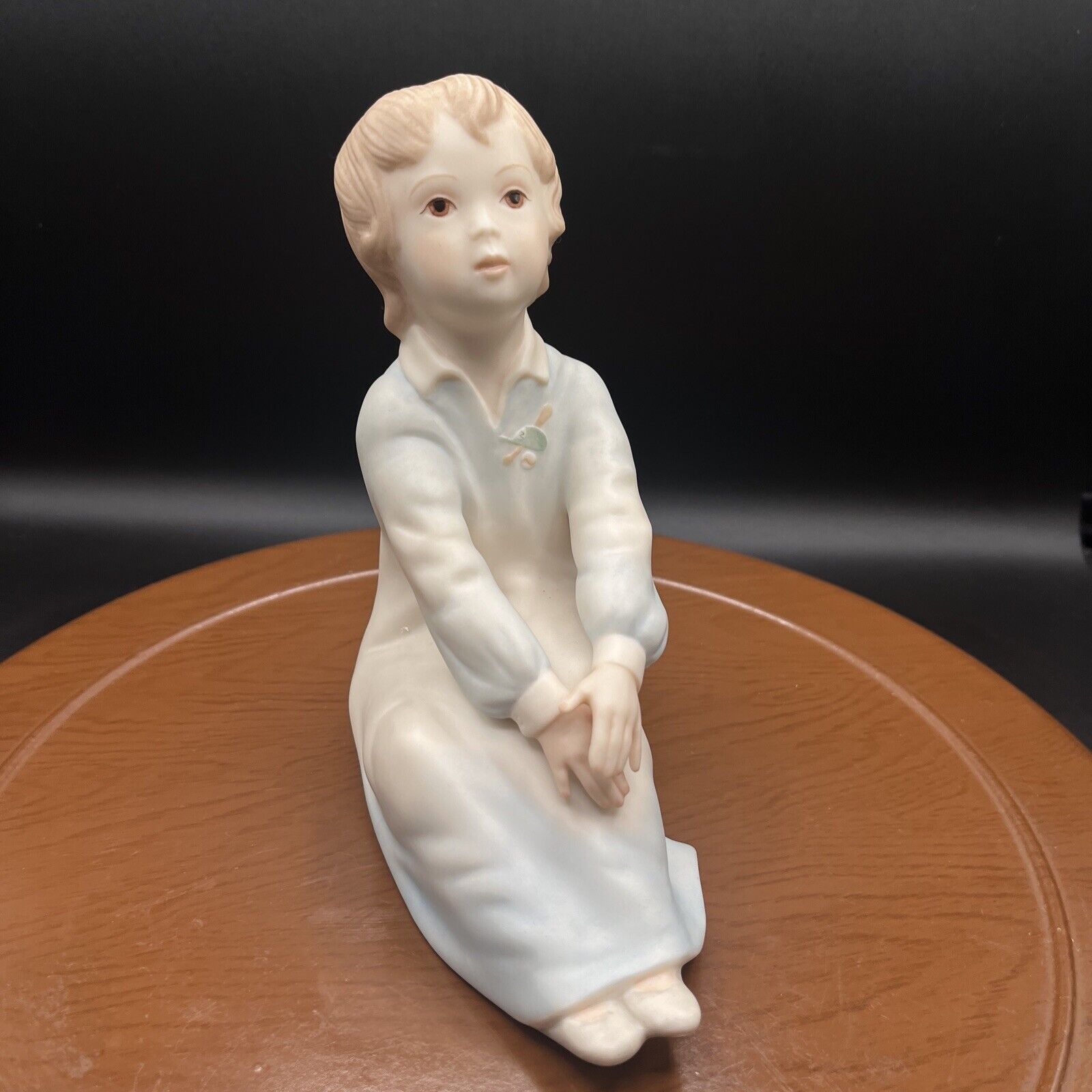 Goebel  Bisque Young Boy in nightgown Seated Figurine by Laszlo Ispanky