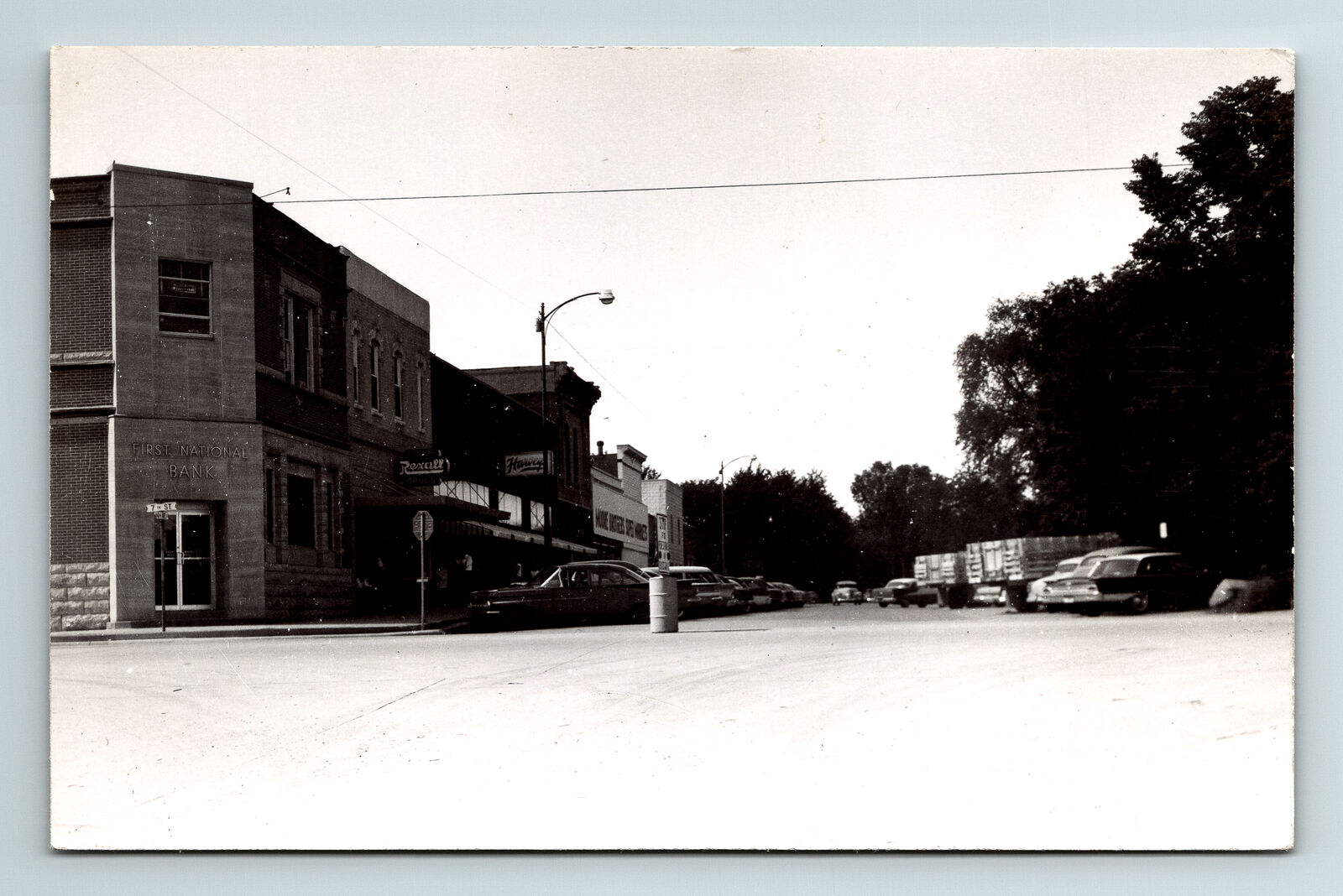 RPPC Postcard Unknown City Town 14th Ave & 7th St? Rexall First Nat'l Bank