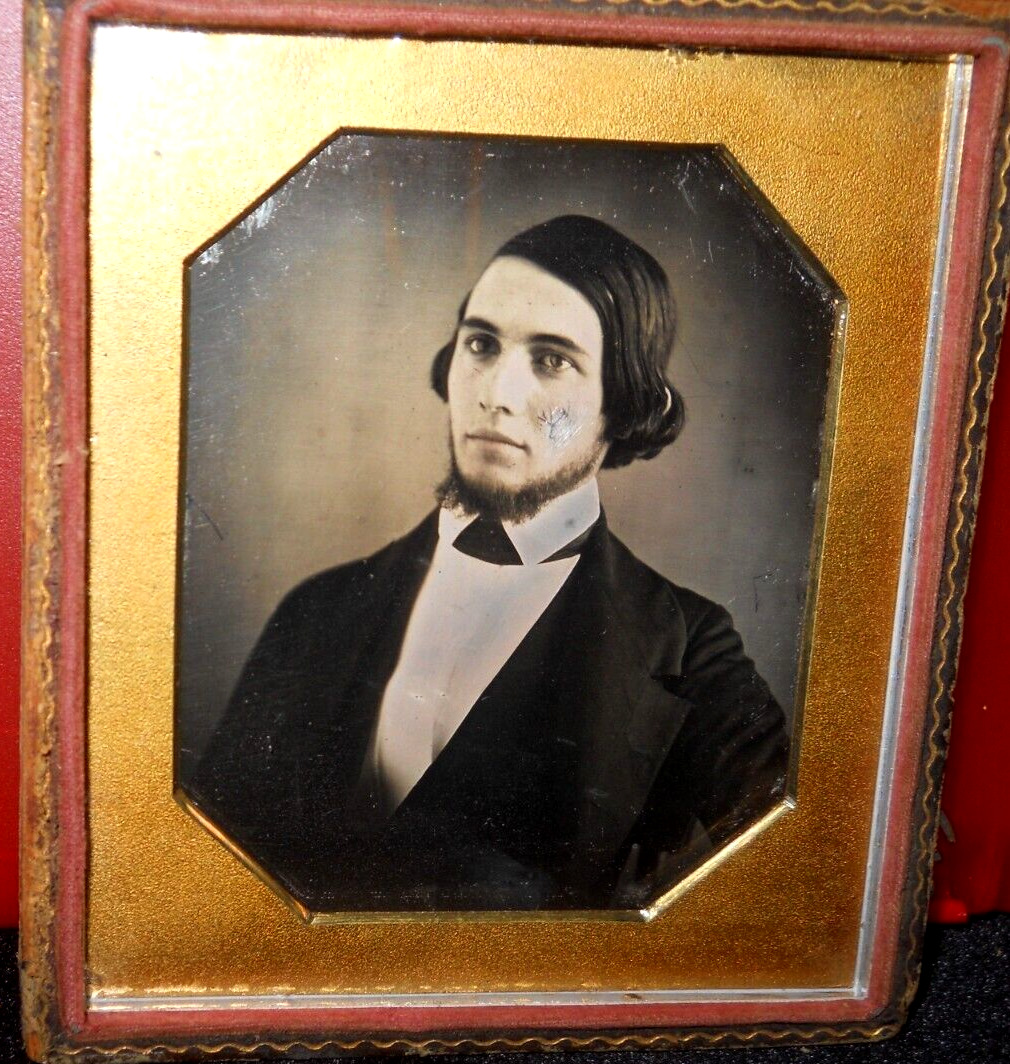 1/6th size Daguerreotype of young man in half case
