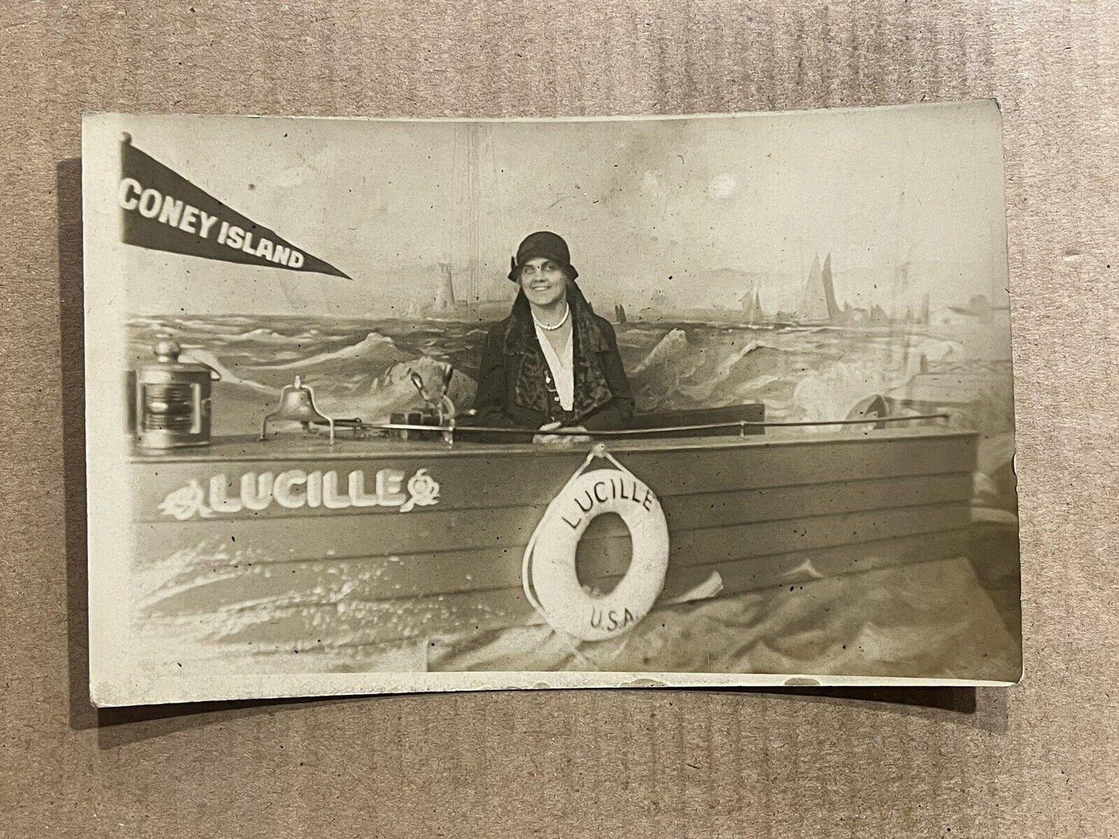 Postcard RPPC Coney Island Flag Girl Woman Studio Prop Boat Lucille Real Photo