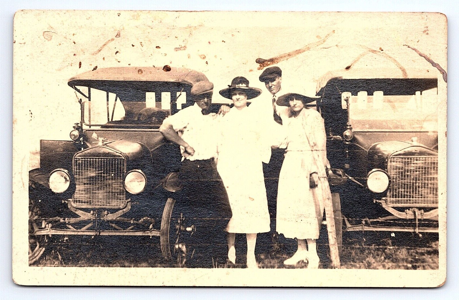 RPPC Real Photo Two Couples Posing Next to Two Matching Antique Cars