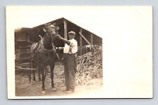 c1911 RPPC Man by Wood Pile With Horse & Buggy Carriage CM Mediker Postcard picture