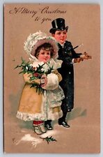 Dressed up Boy and Girl Merry Christmas to You Embossed c1910 Postcard picture