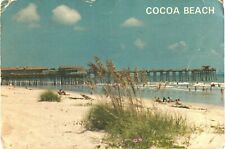 People Enjoying The Beautiful White Sand of Cocoa Beach, Florida Postcard picture