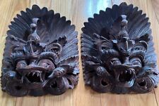A pair of Balinese Garuda acacia wood masks carved by Indonesian craftsmen picture