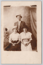 RPPC Man and Two Women Studio Portrait c1910 Real Photo Postcard picture