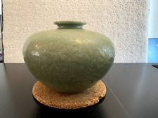 A Chinese Yaozhou-ware celadon porcelain jar carved with flowers picture