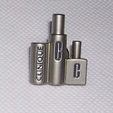 Clinique Cosmetics Employee Lab Coat Lapel Pin: Trio Set of Soap, Lotion Bottles picture