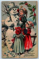 Christmas Postcard Childrens Build Snowman On Winter Holly Berries c1910's picture