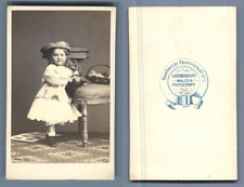 Kindermann, Hamburg, little girl in CDV basket. vintage albumen print.  Pulg picture