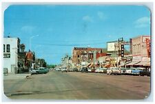 1960 8th Avenue And Business District Cafe Drugs Store Cars Greeley CO Postcard picture