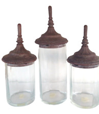 HOME COLLECTION BY AUSTIN SCULPTURES A SET OF GLASS JARS WITH A DECO LID 1999.. picture