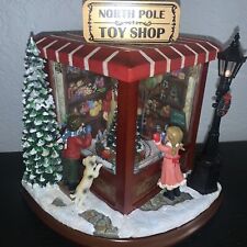 Roman Amusements Santa Claus North Pole Toy Shop Light Up Christmas Music Box picture