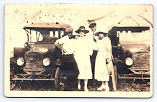 RPPC Real Photo Two Couples Posing Next to Two Matching Antique Cars picture