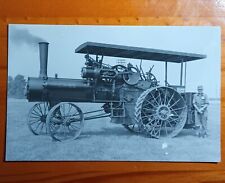rppc of an ohio case steam tractor, standing beside the proud owner. picture
