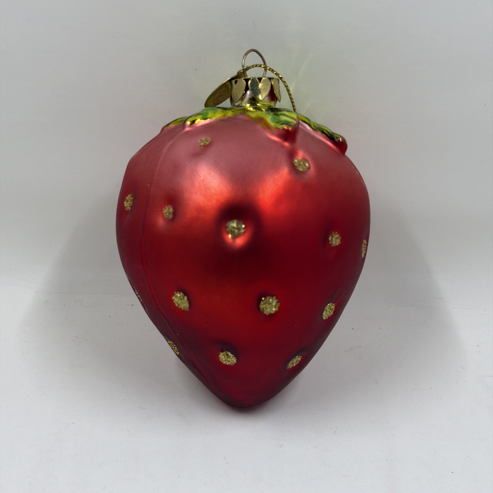 Juicy Couture glass strawberry Christmas ornament. Juicy Couture glass strawberry Christmas ornament.