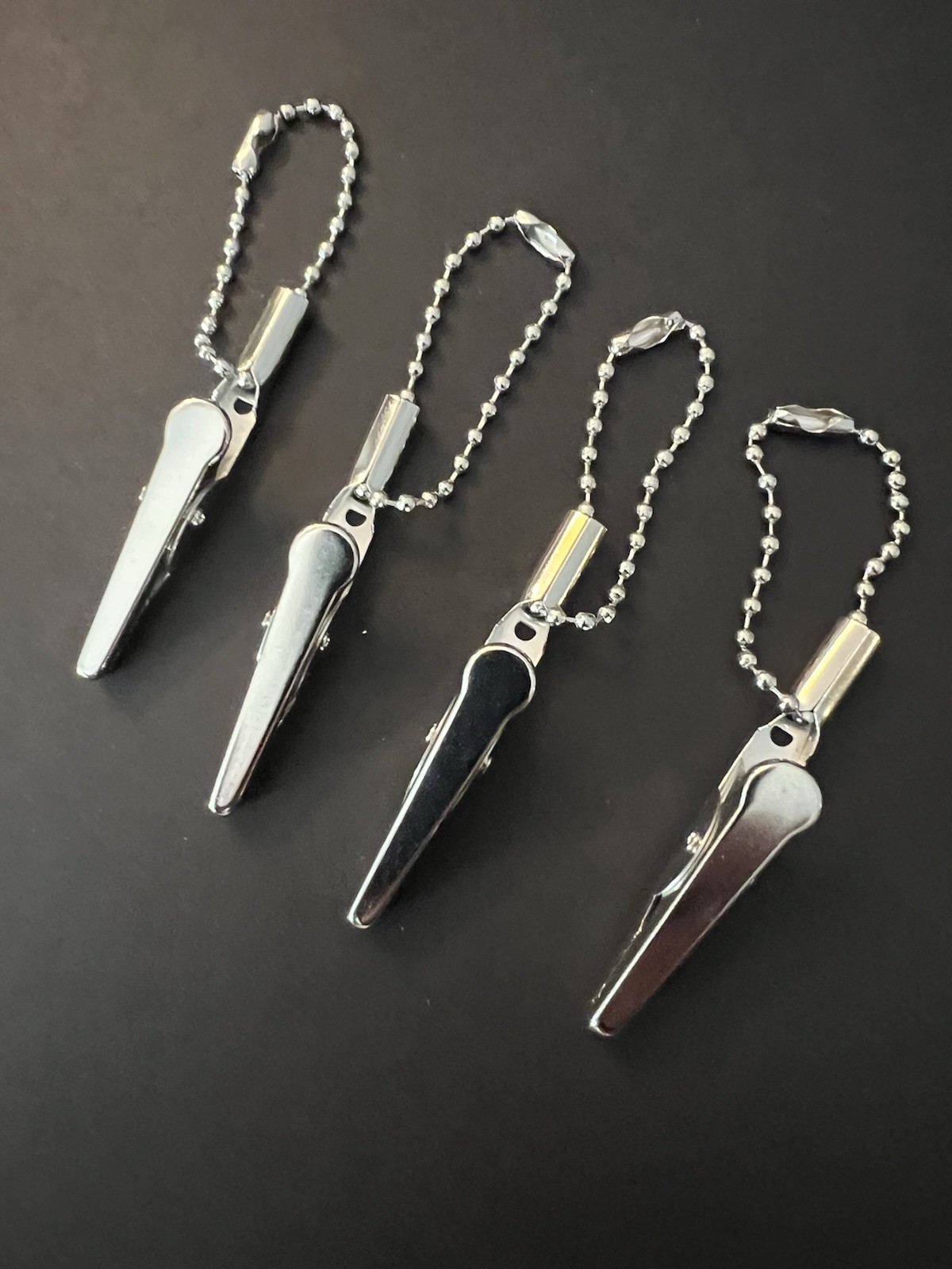 4 Metal Alligator Blount Roach Clips with attached snap Bead Silver Chain 4 Metal Alligator Blount Roach Clips with attached snap Bead Silver Chain