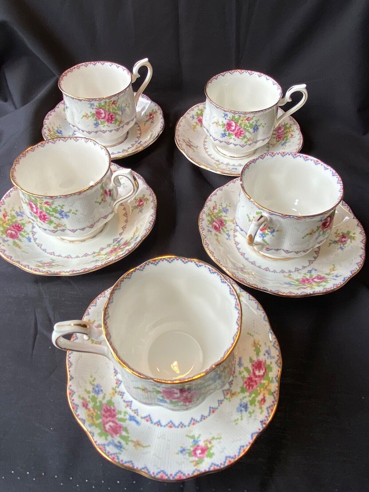 FIVE ROYAL ALBERT CUPS AND SAUCERS - PETIT POINT