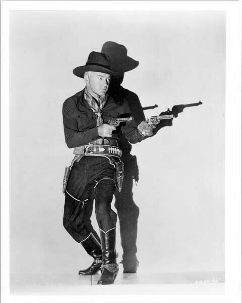 William Boyd with both guns drawn as Hopalong Cassidy 8x10 inch photo