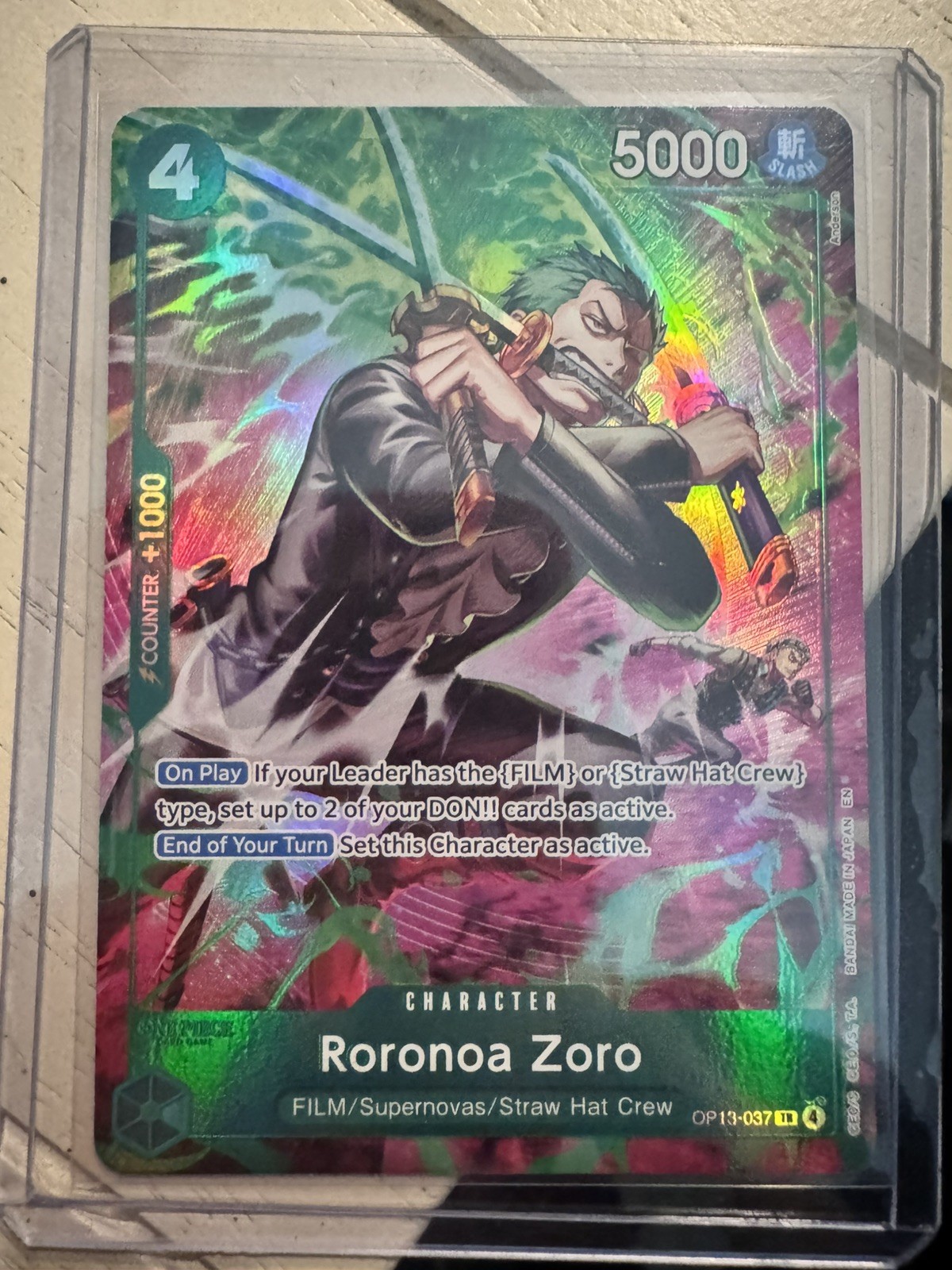 One Piece TCG OP-15/EB04 Roronoa Zoro OP13–037 Treasure Rare NM Looks PSA 10 One Piece TCG OP-15/EB04 Roronoa Zoro OP13–037 Treasure Rare NM Looks PSA 10