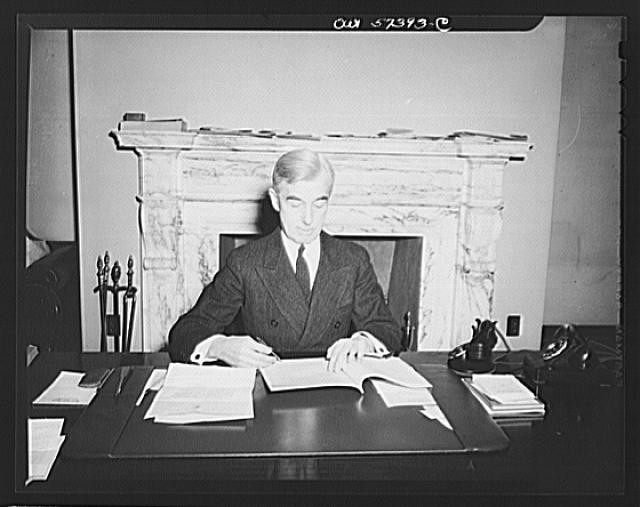 Photo:Man Writing at Desk Fireplace 1935-1945 Black and White Portrait