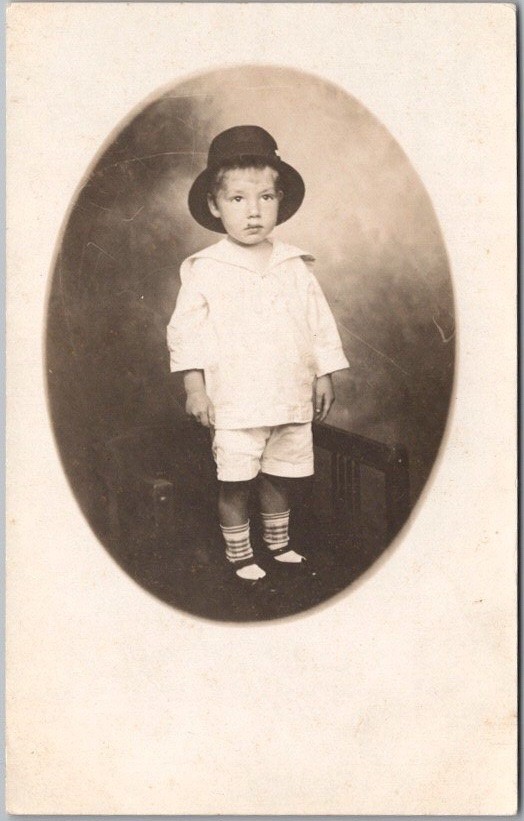 c1910s Studio Photo RPPC Postcard Little Boy in White Outfit and Bucket Hat