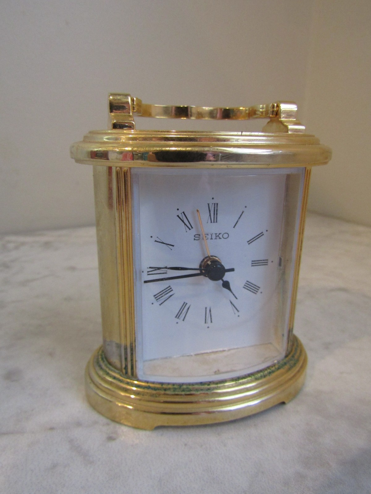 Vintage QHE109GLH Seiko Quartz Carriage Design Clock Metal Frame Roman Numerals