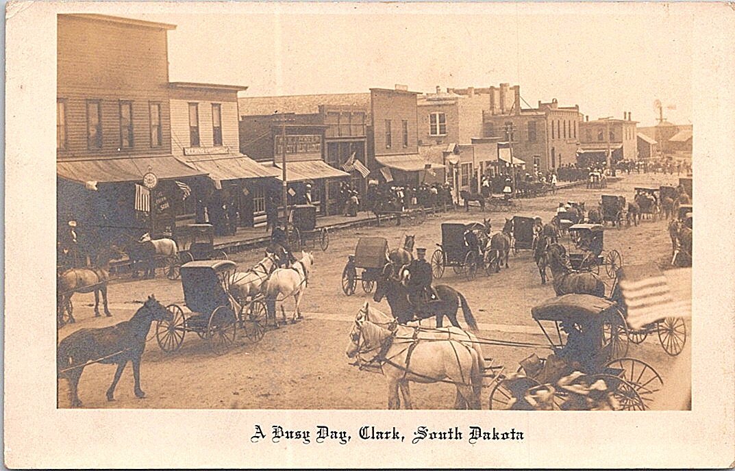 RPPC Clark South Dakota Busy Street Scene Wagons Carriages early 1900s