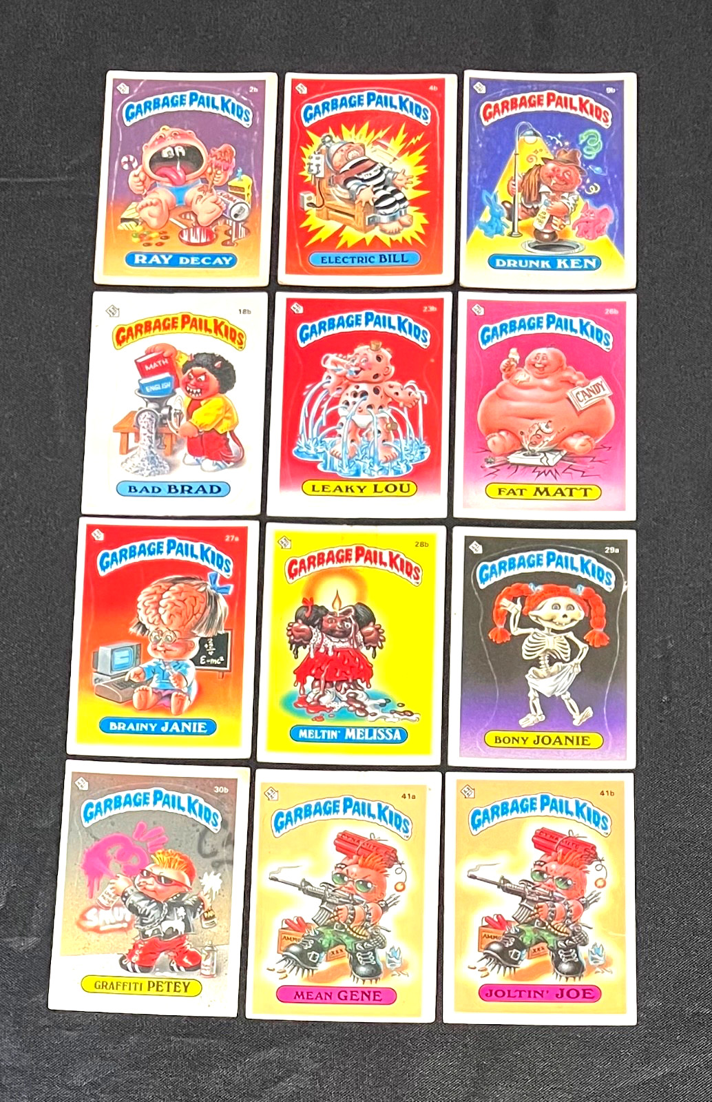1985 Topps Garbage Pail Kids (12) Series 1 GLOSSY GPK OS1 Card Lot  *CgC605*